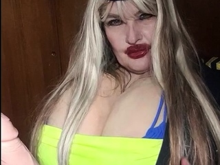 Susi is sitting and rubbing toy cock enjoy it