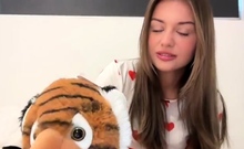 Cute amateur teen girl toying her pussy in bed on cam