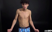 Curly twink boy shows off his slim body on webcam